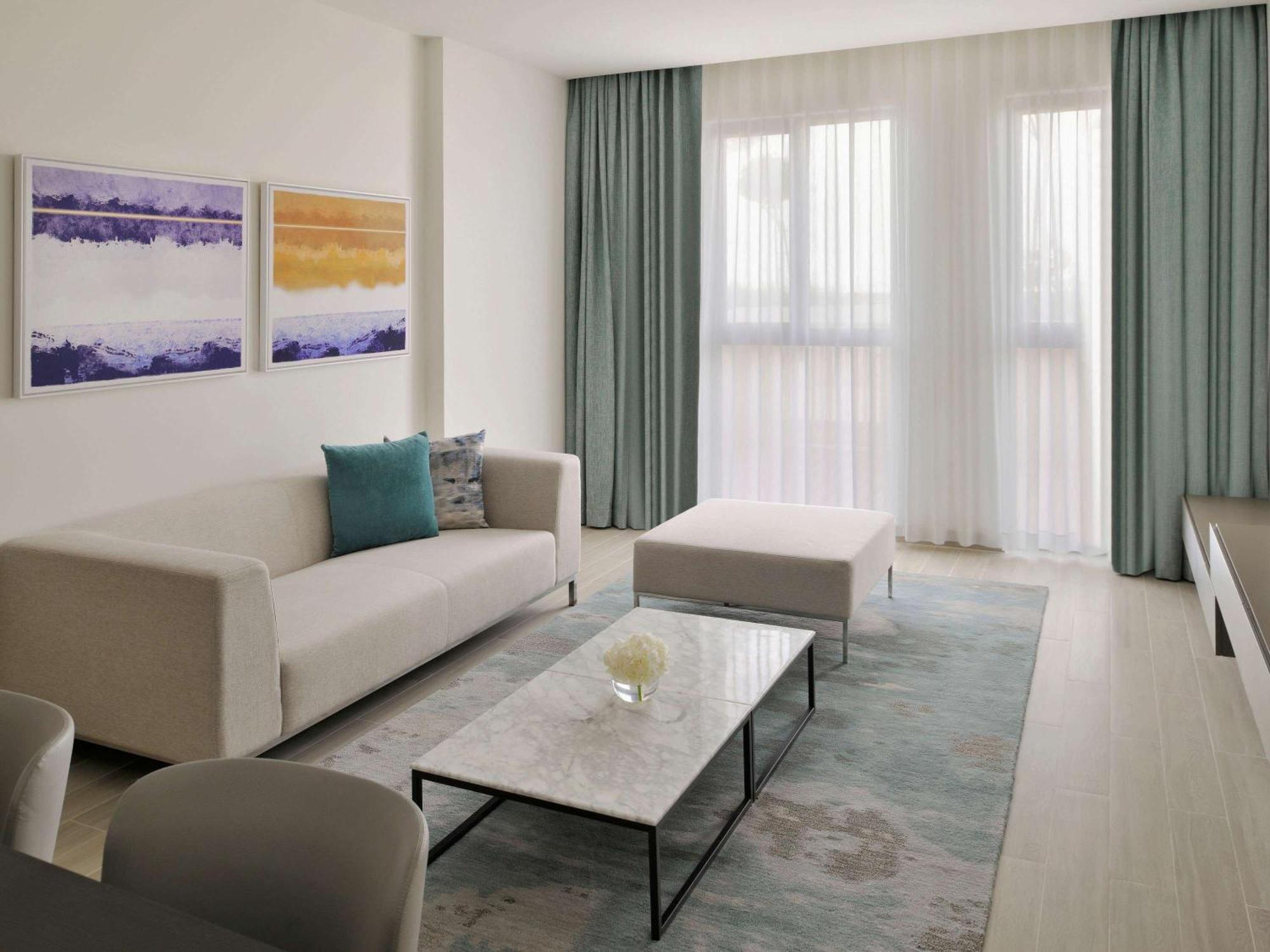 Moevenpick Hotel & Apartments Ghala Маскат Екстериор снимка A living room