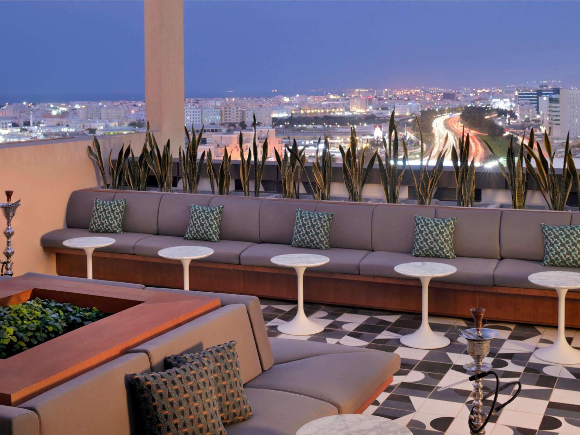 Moevenpick Hotel & Apartments Ghala Маскат Екстериор снимка The rooftop lounge at the Hotel Indigo
