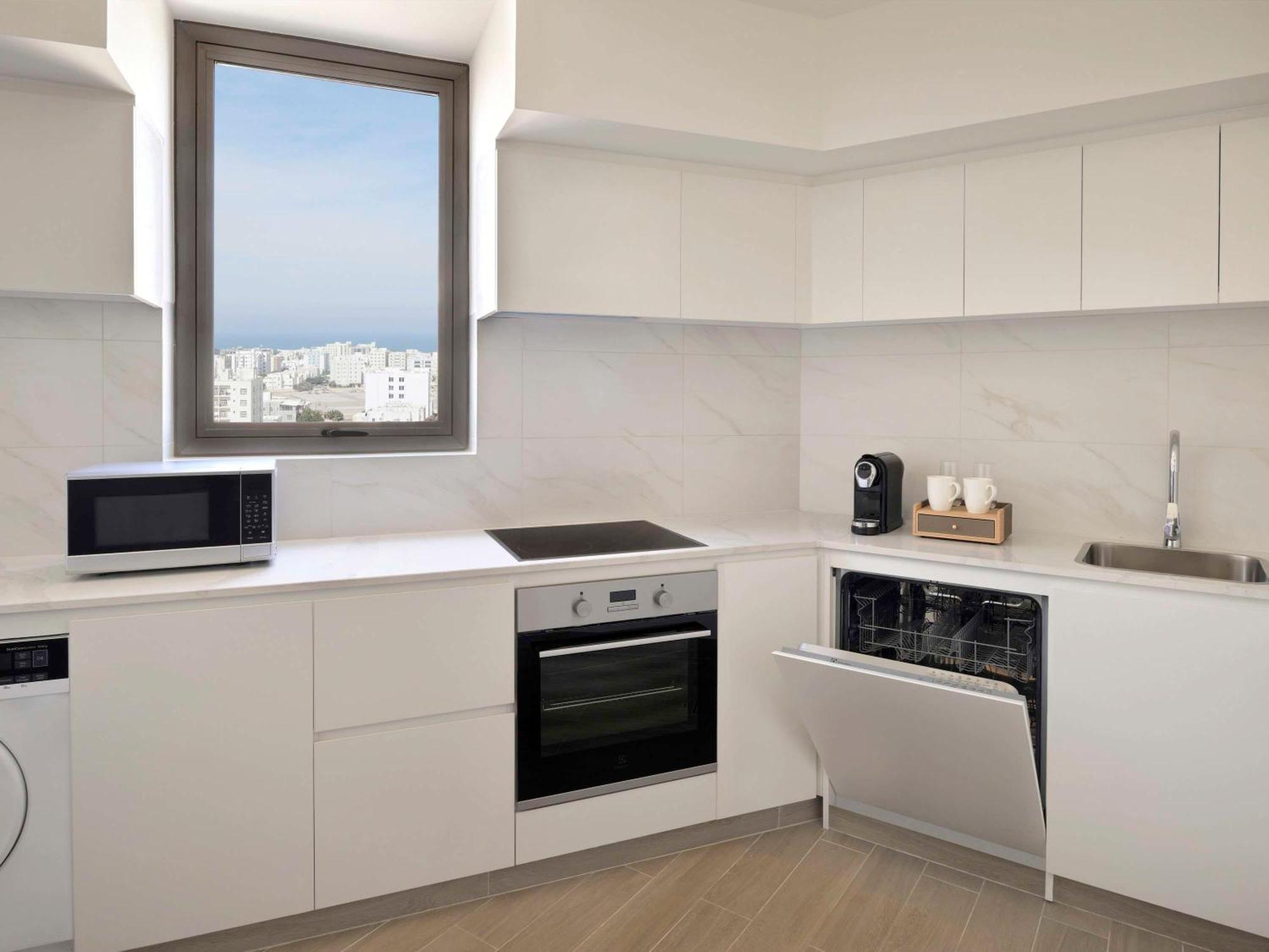Moevenpick Hotel & Apartments Ghala Маскат Екстериор снимка A modern kitchen